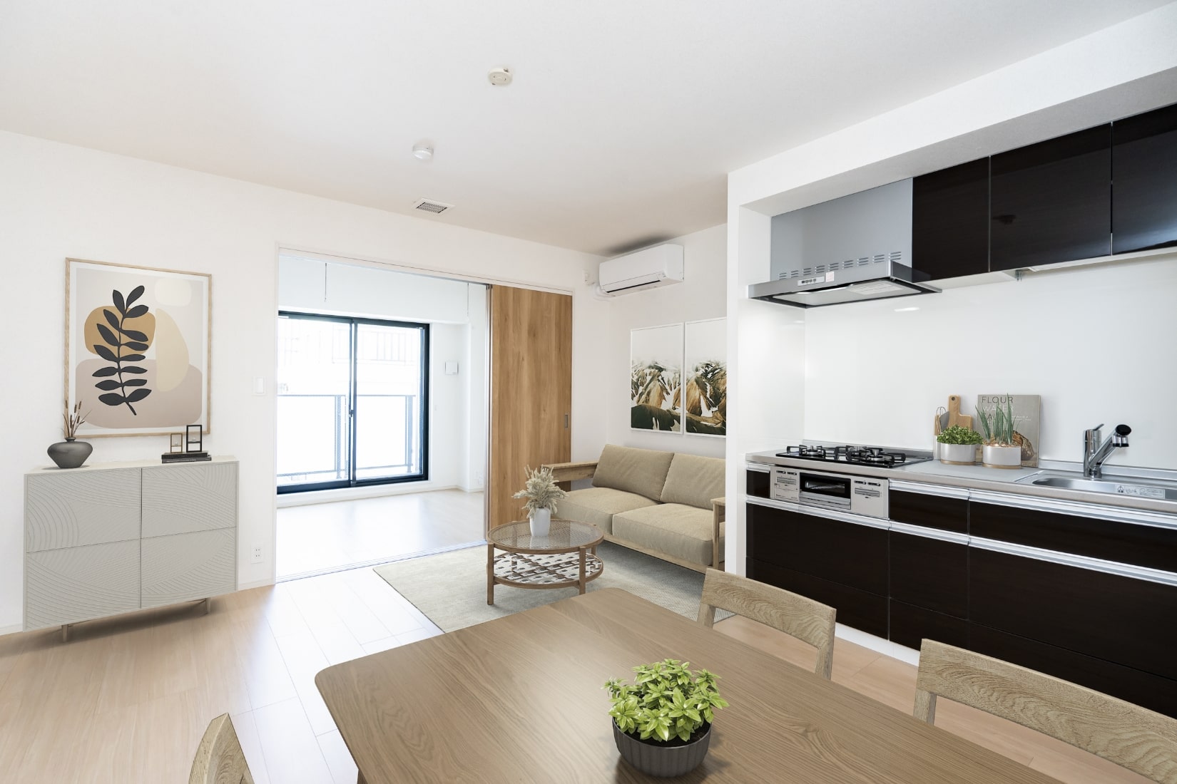 A furnished apartment with a dining table, sofa and open kitchen